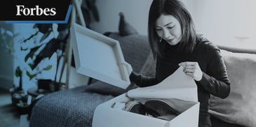 woman opening shoe box